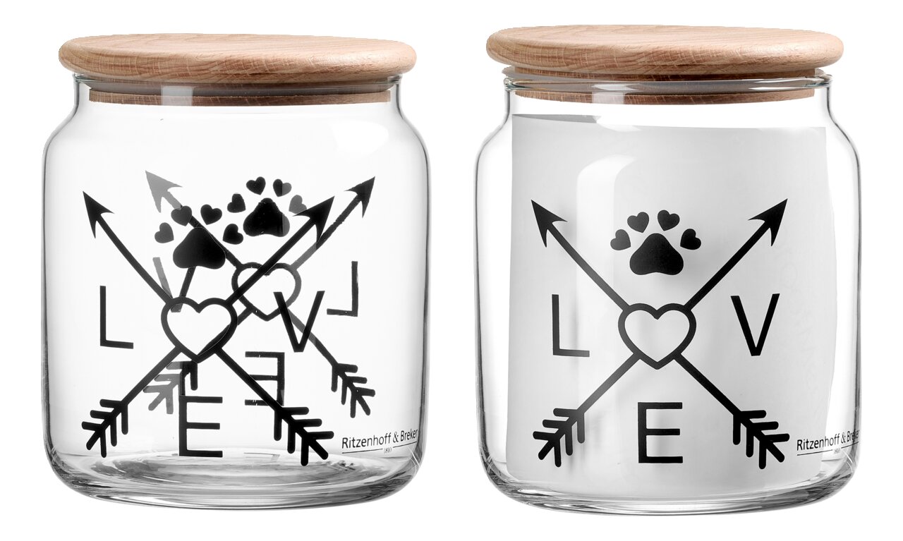 Glasdose mit Holzdeckel, verziert mit schwarzen Pfeilen, Herzen und Pfotenabdruck, aus der Frontalperspektive.