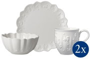 Frontalansicht eines sechsteiligen Frühstückssets mit Teller, Schale und Tasse, verziert mit erhabenen Motiven.