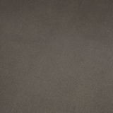 Nahaufnahme einer dunkelgrauen, strukturierten Oberfläche, möglicherweise Stoff oder Leder, von oben betrachtet.