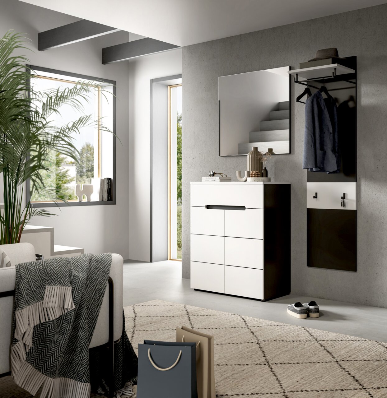 Modernes Flurmöbel-Set in Weiß und Schwarz mit Schuhkommode, Wandspiegel und Garderobenpaneel mit Kleiderstange und Ablage, in heller Diele – Perspektive: frontale Ansicht mit leichtem Blick von links