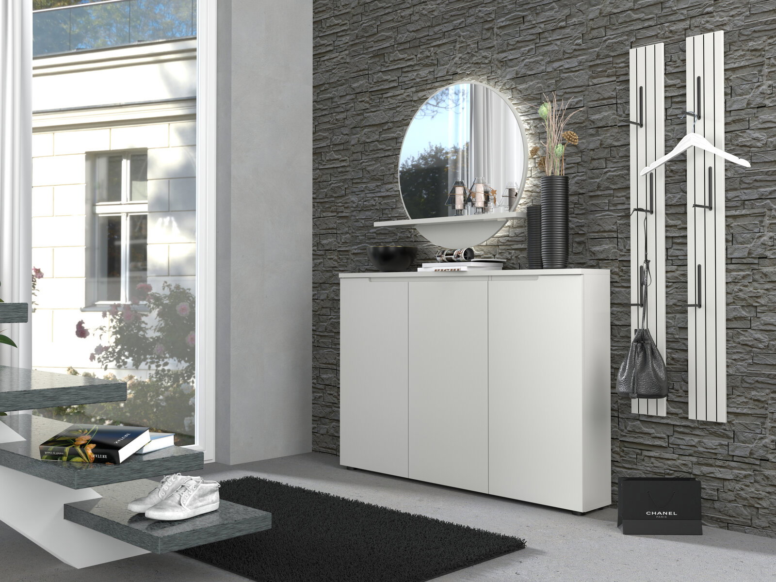 Modernes weißes Sideboard im Flur vor grauer Steinwand, mit rundem Spiegel und Deko auf der Ablage Ansicht schräg von vorn.