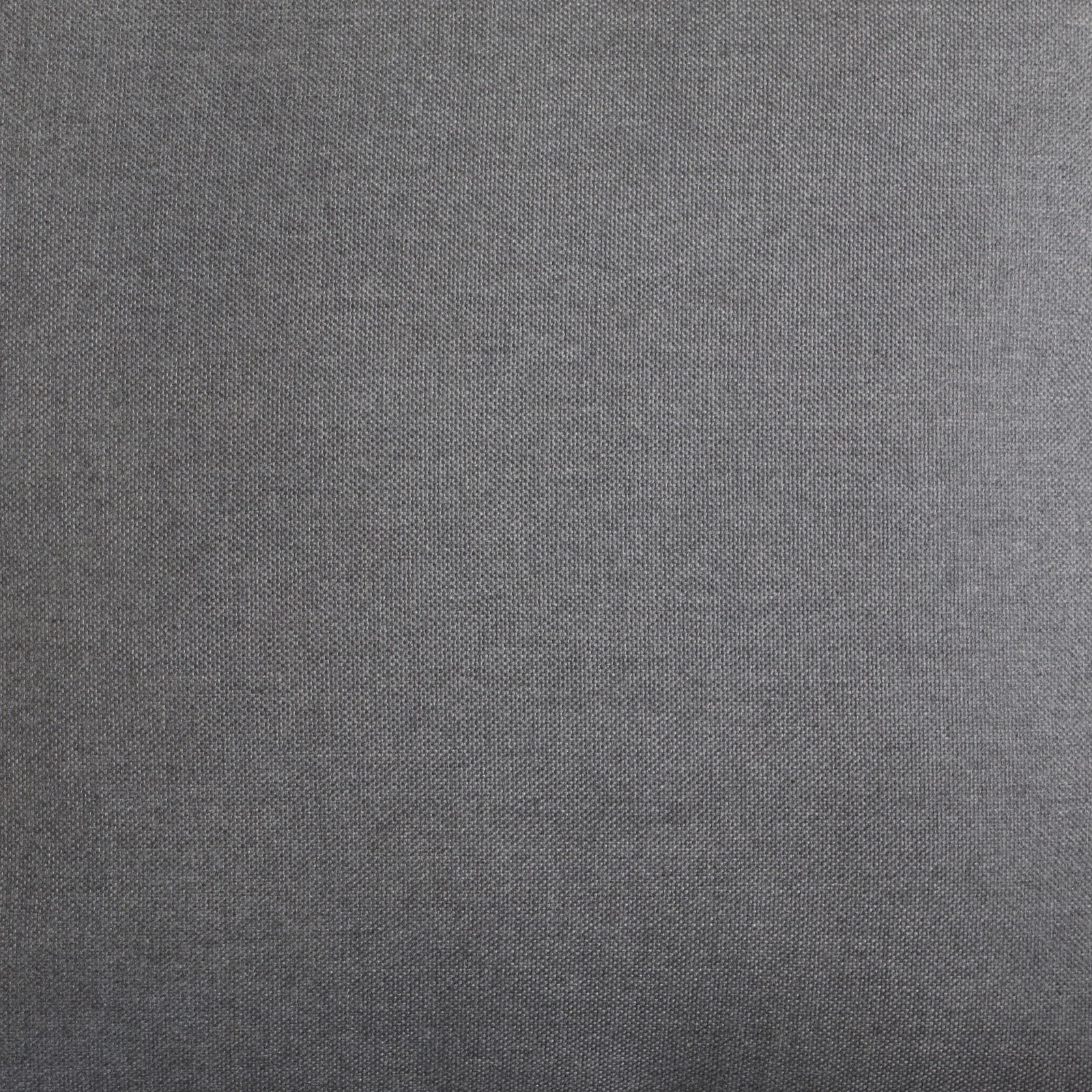 Nahaufnahme eines grauen Stoffes, vermutlich Polsterung eines Lounge-Sessels, aus der Vogelperspektive.