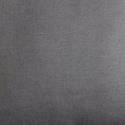 Nahaufnahme eines grauen Stoffes, vermutlich Polsterung eines Lounge-Sessels, aus der Vogelperspektive.