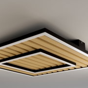 Moderne quadratische Deckenleuchte mit schwarzem Rahmen, weißen Lichtflächen und Holzlamellen, aus Untersicht schräg von unten fotografiert