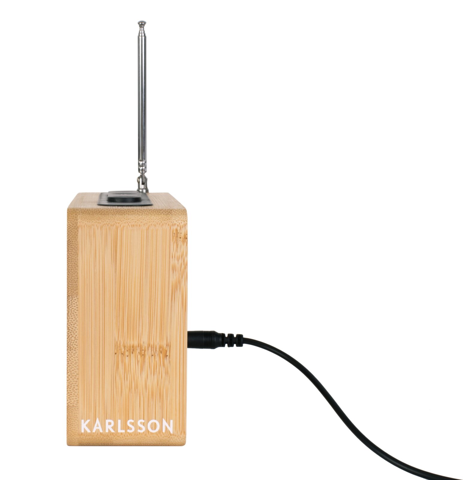 Zijaanzicht van een houten wekkerradio met antenne en netsnoer