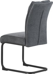 Gepolsterter Freischwinger-Stuhl mit dunkelgrauem Stoffbezug und schwarzem Metallgestell, Seitenansicht schräg von hinten