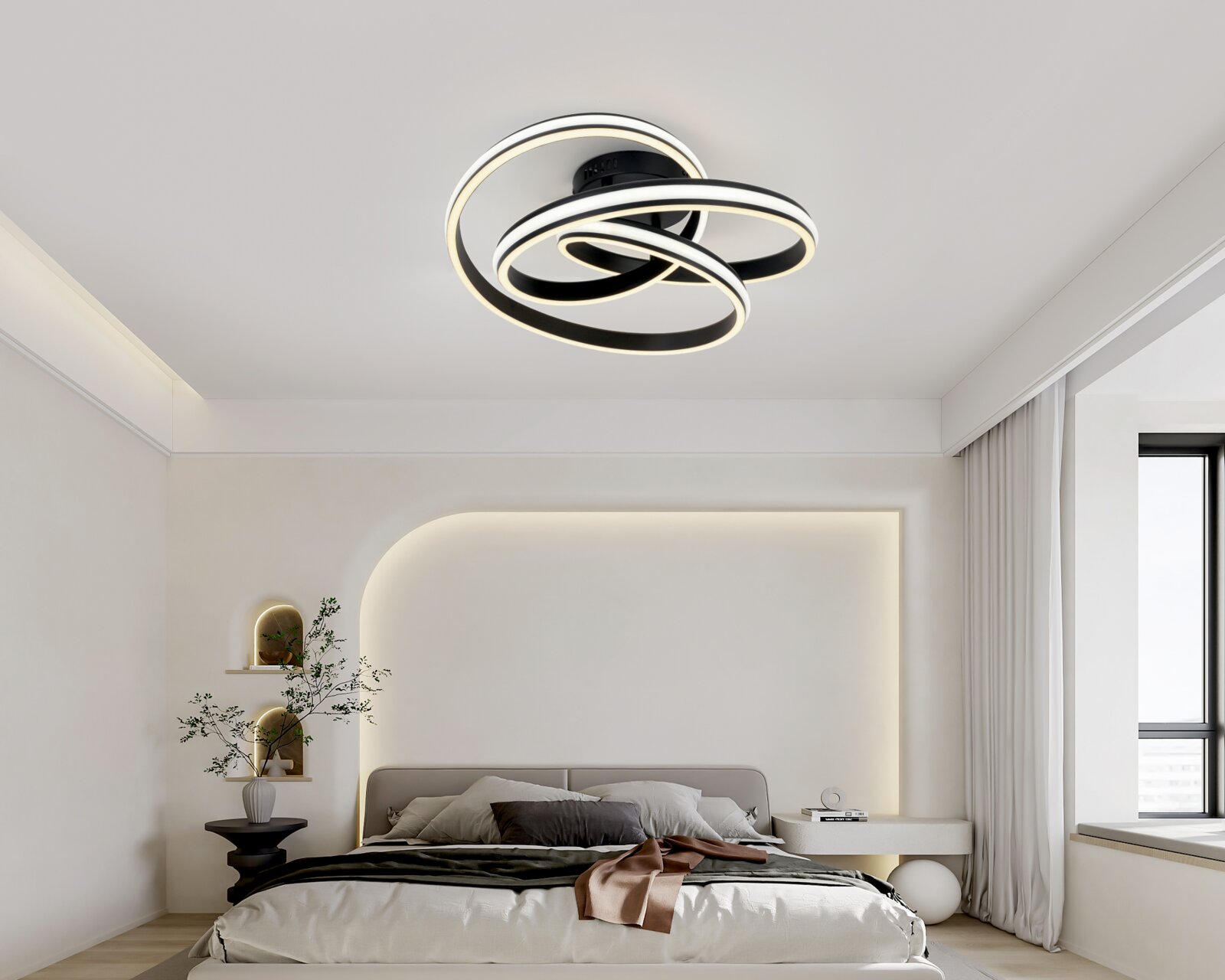 Novel LED-Deckenleuchte DECKENLEUCHTE Moderne LED-Deckenleuchte in Schwarz mit drei überlappenden, leuchtenden Ringen in warmweiß, montiert an der Zimmerdecke; Perspektive: leicht von unten im Schlafzimmer aufgenommen.