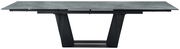 Moderner Esstisch mit grauer Tischplatte und schwarzem, geometrischem Untergestell, seitliche Perspektive