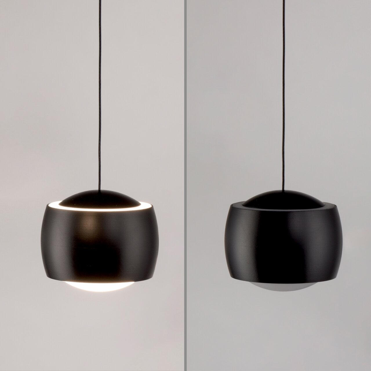 Moderne schwarze Pendelleuchte aus seitlicher Perspektive, mit elegantem, rundem Design und sanftem Lichtaustritt.