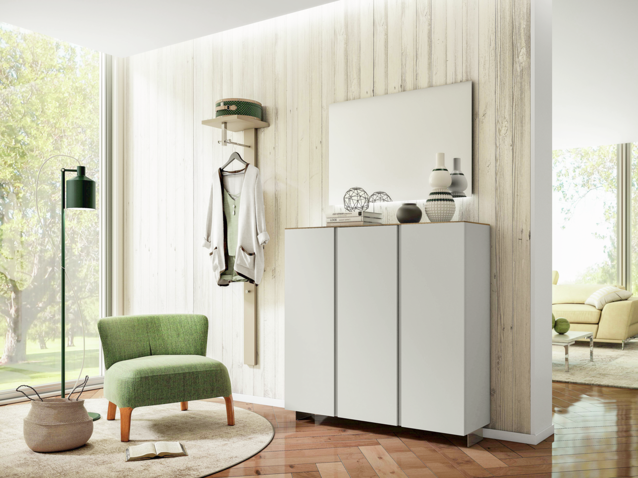 Moderano Garderoben-Set LECCO Moderner Eingangsbereich mit Garderobenset, bestehend aus einem weißen Hängeschrank und einem Spiegel, im Vordergrund ein grüner Sessel. Perspektive von schräg vorne.