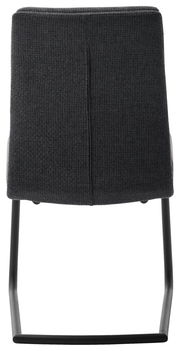 Rückansicht eines Freischwinger-Stuhls mit dunklem Stoffbezug und schwarzem Metallgestell.