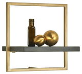 Wandregal mit goldfarbenem Rahmen und grauer Ablage, darauf eine braune Flasche und zwei goldene Kugeln, seitliche Perspektive