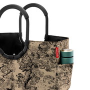 Loopshopper L mit schwarzem Griff und beige-schwarzem Baum-Muster, seitliche Perspektive, mit einer Dose in der Seitentasche.