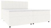 Wit boxspringbed met een gestoffeerd, vierkant doorgestikt hoofdeinde en een zwart onderstel, zijaanzicht in licht perspectief vanaf linksvoor