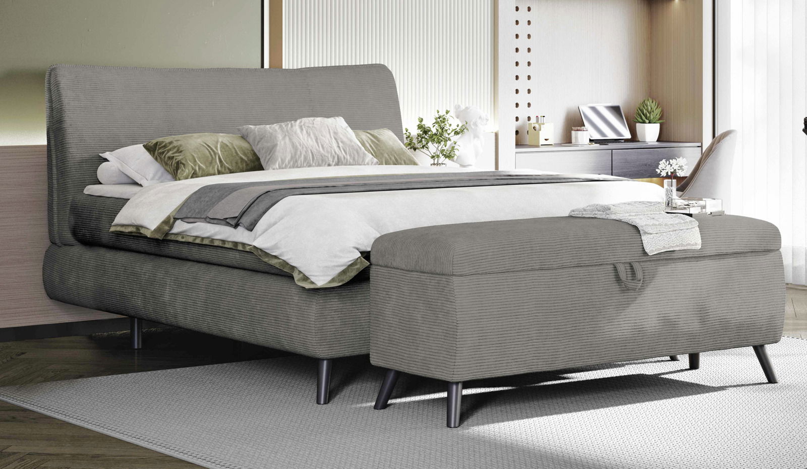 Graues Boxspringbett 180x200 mit Bettbank im Vordergrund, seitliche Perspektive