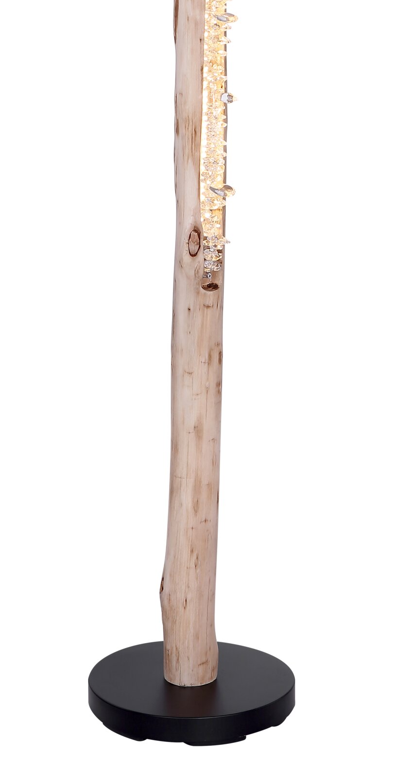 Stehleuchte aus naturbelassenem Holzstamm mit warmweiß leuchtender Kristall-/Glasleiste auf schwarzem Rundsockel, seitliche Ansicht vor weißem Hintergrund
