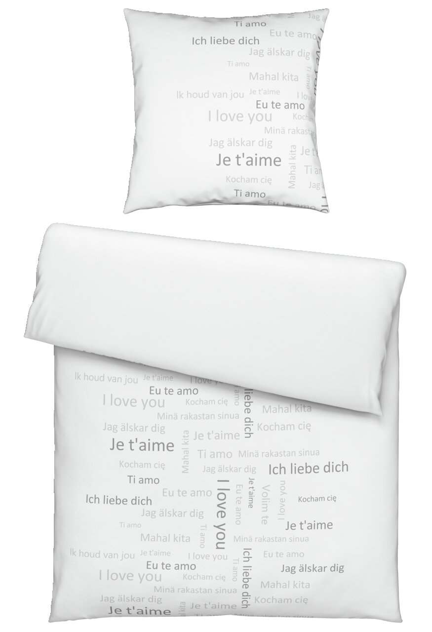 Bettwäsche-Set mit Kissenbezug und Deckenbezug, bedruckt mit 'Ich liebe dich' in verschiedenen Sprachen, von oben betrachtet.