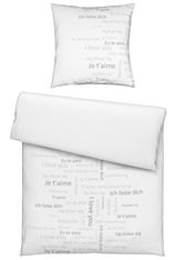 Bettwäsche-Set mit Kissenbezug und Deckenbezug, bedruckt mit 'Ich liebe dich' in verschiedenen Sprachen, von oben betrachtet.