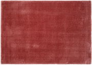 Roter, rechteckiger Teppich aus der Vogelperspektive fotografiert, weiche Textur, ca. 120 cm rund.