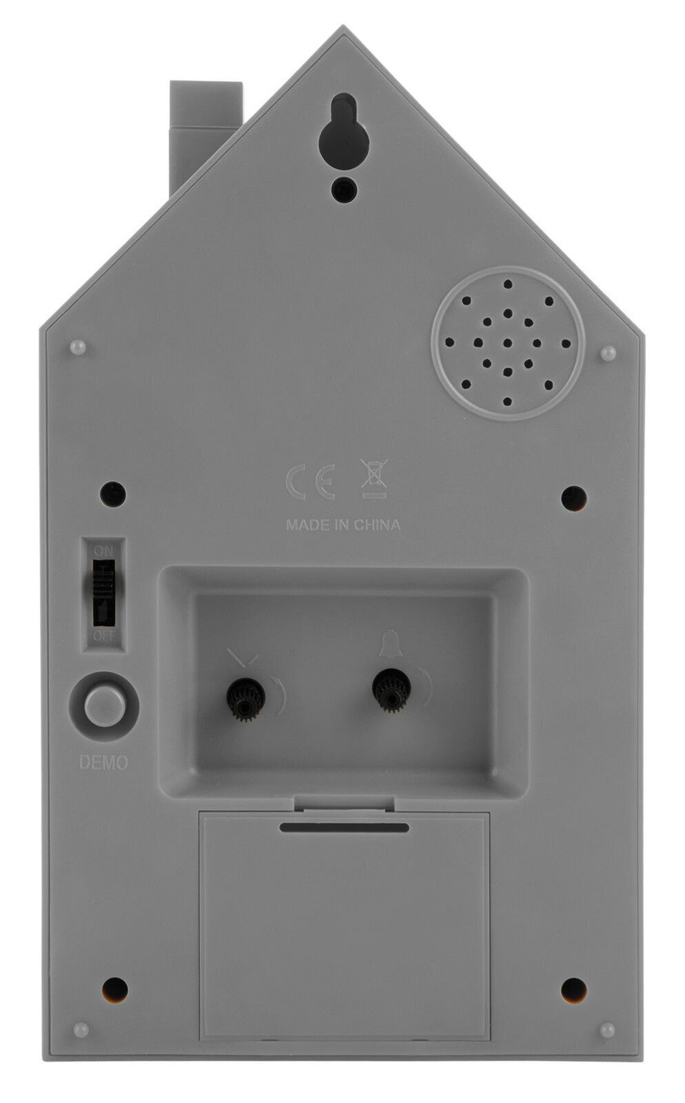 Rückansicht eines modernen Weckers in Hausform mit Bedienelementen und Lautsprecher.