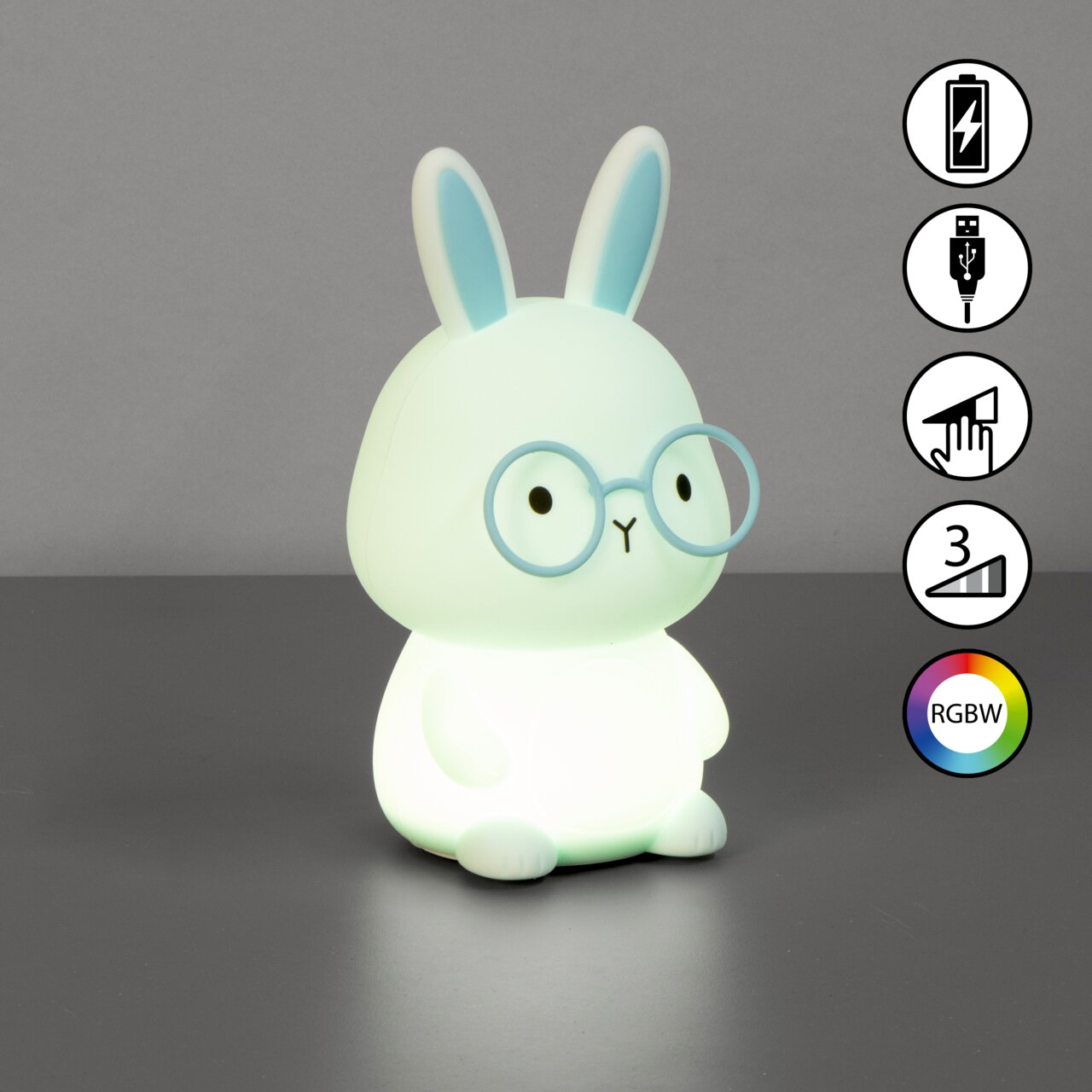 Niedliches Akku-Nachtlicht in Form eines Hasen mit Brille, seitliche Perspektive, leuchtet in verschiedenen Farben.