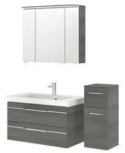 Badezimmermöbel-Set bestehend aus einem Spiegelschrank, einem Waschbeckenunterschrank mit zwei Schubladen und einem hohen Schrank, in moderner grauer Holzoptik, frontal betrachtet.