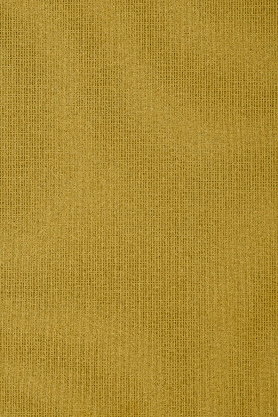 Nahaufnahme eines gelben Stoffes mit feiner Textur, von oben betrachtet.