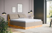 Modernes Polsterbett in einem stilvollen Schlafzimmer, seitliche Perspektive mit hölzernem Rahmen und bequemen Kopfstützen.