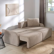 Beiges Ecksofa JENIFER in einem modernen Wohnzimmer, seitliche Perspektive, mit Kissen und dekorativem Wandbild.