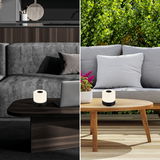 Akku LED Tischleuchte in modernem Design, schwarz, auf einem Tisch in Innen- und Außenbereich, seitliche Perspektive
