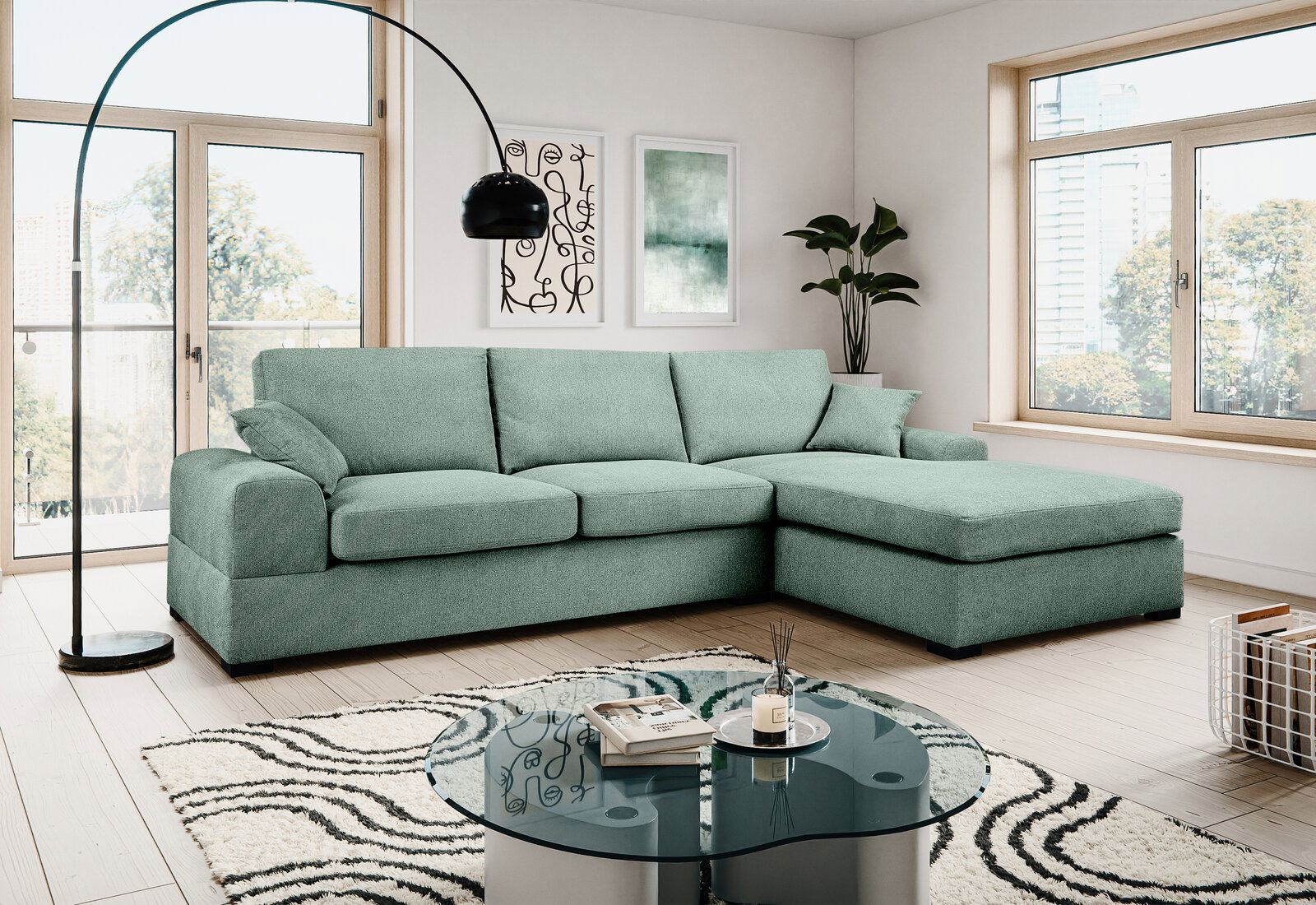MID.YOU Hoekbank VEDA Mintgrünes L-förmiges Ecksofa mit rechter Ottomane in modernem Wohnzimmer, Frontansicht in leichter Schrägperspektive von vorn.