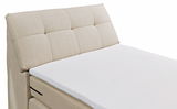 Beige Boxspringbett mit gepolstertem Kopfteil, seitliche Perspektive