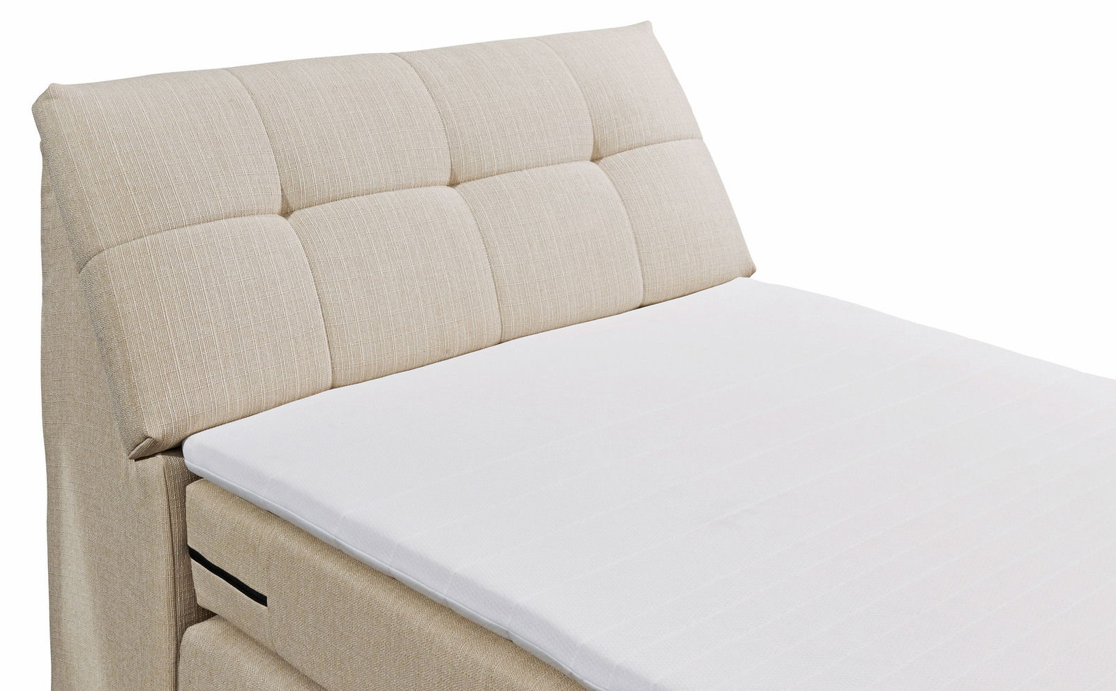 Beige Boxspringbett mit gepolstertem Kopfteil, seitliche Perspektive