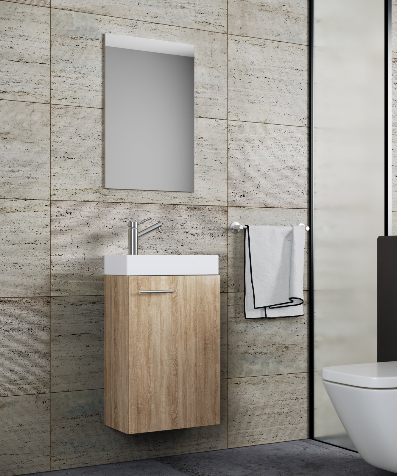 Modernes Badezimmer-Waschbecken mit wandhängendem Waschtischunterschrank in heller Holzoptik, weißem Aufsatzwaschbecken und Spiegel über grauer Fliesenwand, seitliche Frontansicht (leicht von rechts).