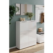 Garderobe Set 1 in moderner, minimalistischer Gestaltung mit weißem Hochglanz-Schrank, Spiegel und Wandhaken, seitliche Perspektive.