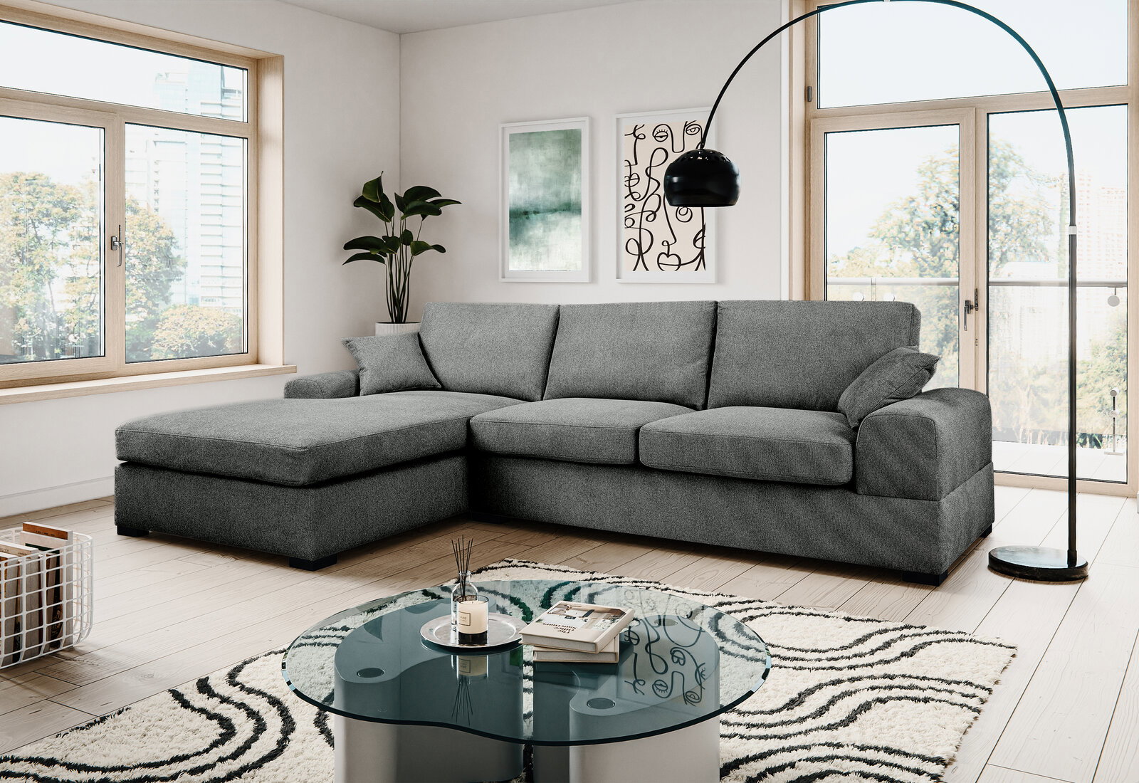 MID.YOU Hoekbank VEDA Modernes graues Ecksofa mit linksseitiger Ottomane und drei Sitzkissen in hellem Wohnzimmer, Frontansicht leicht schräg von vorn.