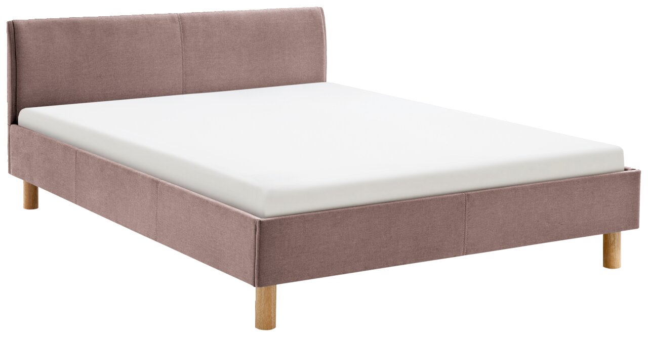 Gestoffeerd bed in roze met houten poten, zijaanzicht