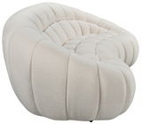 Beiges, geschwungenes 3-Sitzer-Sofa aus weichem Stoff, seitliche Perspektive