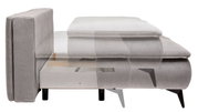 Seitenansicht eines grauen Boxspring-Funktionssofas mit sichtbarem Stauraum unter der Sitzfläche.