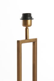 Nahaufnahme eines goldenen Lampenfußes der Light&Living Leuchte SHIVA mit rechteckigem Rahmen und schwarzer Fassung, seitliche Perspektive.