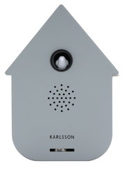 Grijze, moderne luidsprekerkast in de vorm van een huisje met een klein wit vogeltje in het midden, vooraanzicht