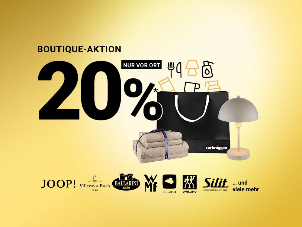 Schwarze Einkaufstasche mit Handtüchern, Tischlampe und Markenlogos vor gelbem Hintergrund