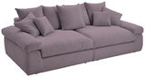 Großes, gemütliches Big-Sofa in Lila mit mehreren Kissen, seitliche Perspektive