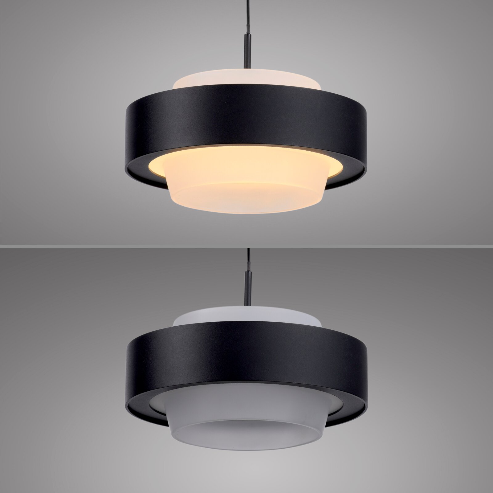 Moderne Pendelleuchte in Schwarz mit weißem Diffusor, eingeschaltet und von leicht unten in Frontansicht fotografiert, vor grauem Hintergrund