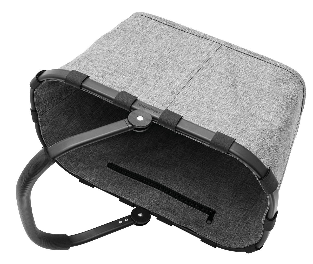 Grauer Einkaufskorb mit schwarzem Rahmen und Griff, von oben betrachtet.