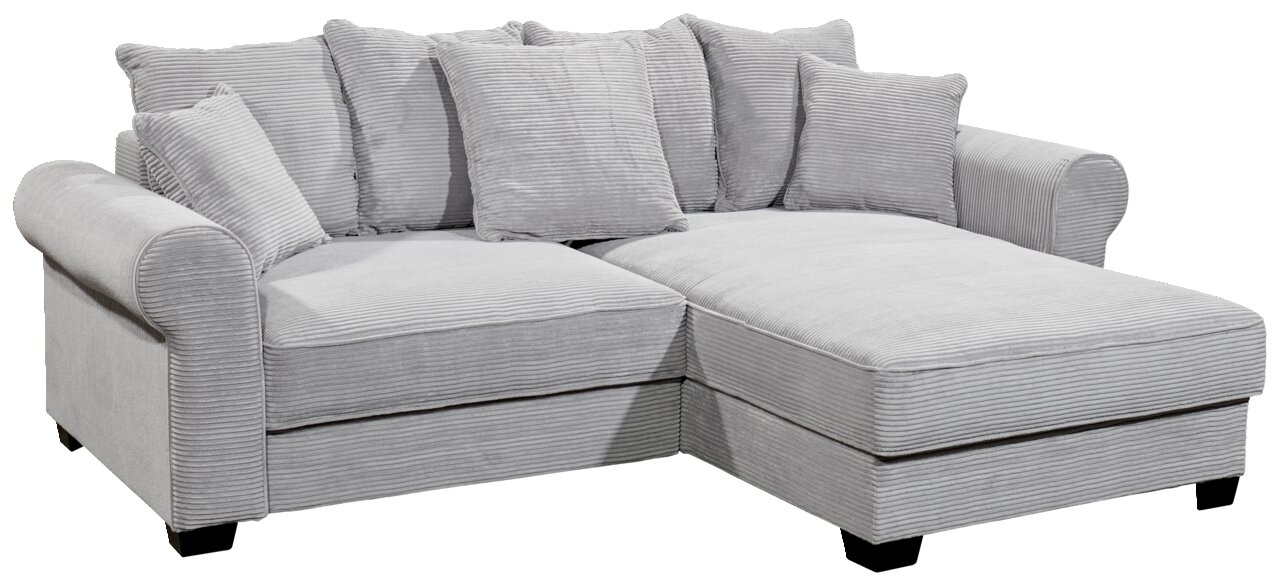 Graues Ecksofa mit mehreren Kissen, aus einer leicht erhöhten Perspektive fotografiert.