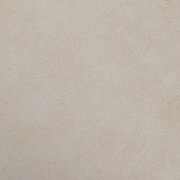 Nahaufnahme einer beigen Textur, möglicherweise Stoff oder Polsterung, von oben betrachtet.