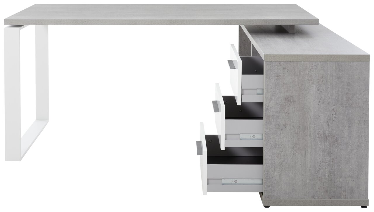 Moderner Eckschreibtisch in Betonoptik mit weißen Metallbeinen und mehreren offenen Schubladen, seitliche Perspektive.