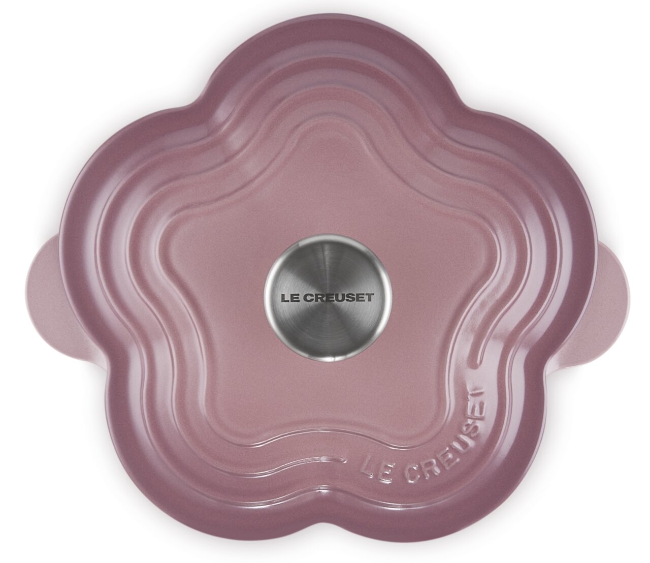 Blumenbräter in Mauve Pink von oben, blütenförmig mit Le Creuset Logo auf dem Deckel.