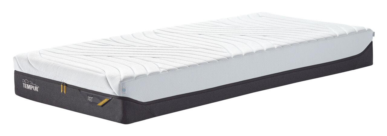 Zijaanzicht van een hoogwaardig matras met een witte hoes en een zwarte rand, geschikt voor optimaal slaapcomfort.